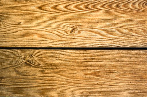 A closeup shot of the beautiful patterns of a wooden surface - good for a background