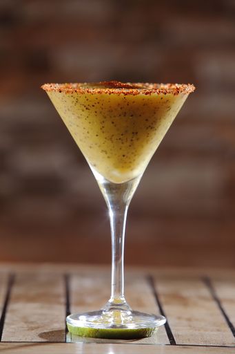 A vertical shot of tasty Maracuya Daiquiri on blurred background
