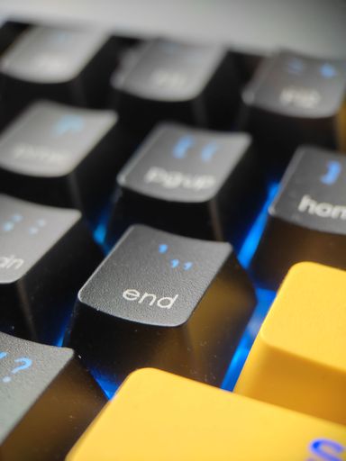A vertical shot of a key on a computer keyboard