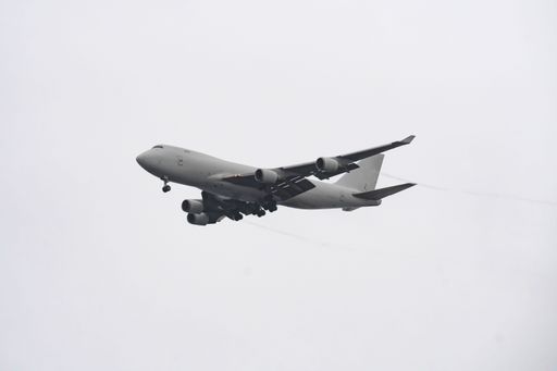 A white airplane four engine jet liner passenger plane