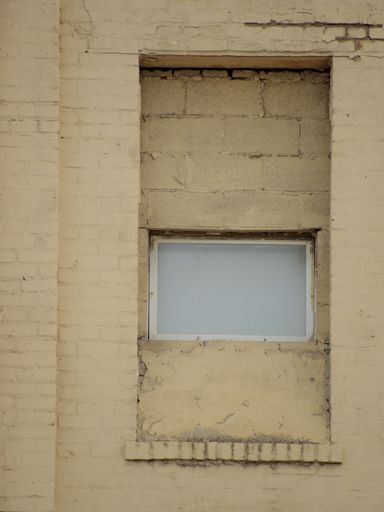 A vertical shot of an abandoned building