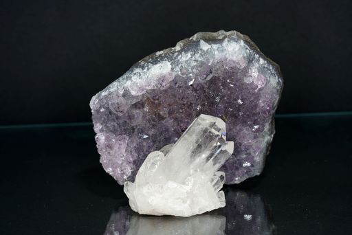 A closeup shot of a purple Amesite crystal rock on a black background
