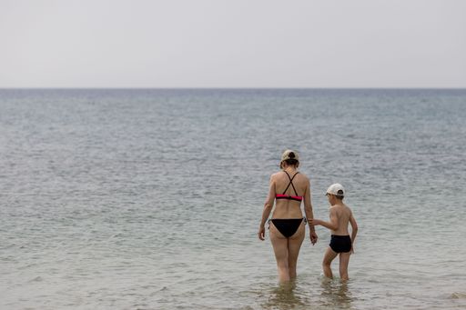 The Mother and son on the beach of the Mediterranean Sea