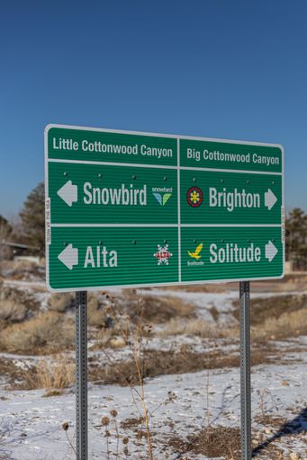 Huge road sign in mountains - showing the directions to little cottonwood canyon and big cottonwood canyon