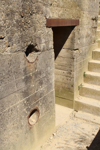 A vertical shot of an old building and stairs made of concrete