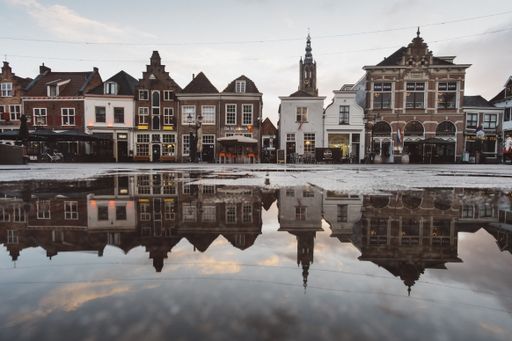 A beautiful shot of old buildings with reflections in the water with