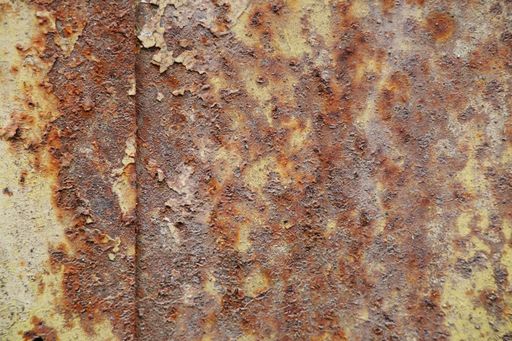 A closeup shot of a rusty cracked wall texture