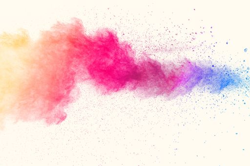 Launched colorful powder explosion splashing on white background