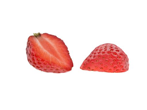 An isolated shot of a sliced strawberry with visible seeds on a white background