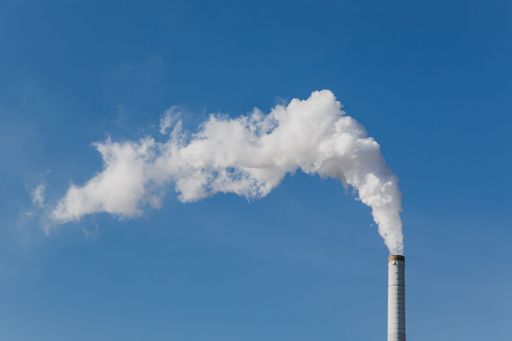 A smoke get out of industrial chimney is a symbol for climate change and pollution