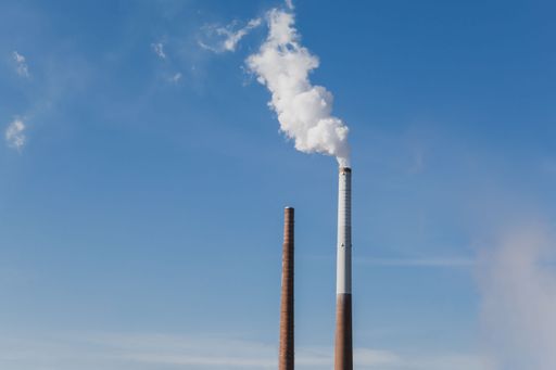 A smoke get out of industrial chimney is a symbol for climate change and pollution
