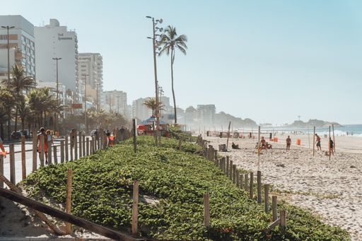 Beautiful landscape shot of the beach in Rio de Janeiro during summer with beautiful mountains on the background.