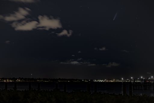 A beautiful shot of a night sky over the city, dark background