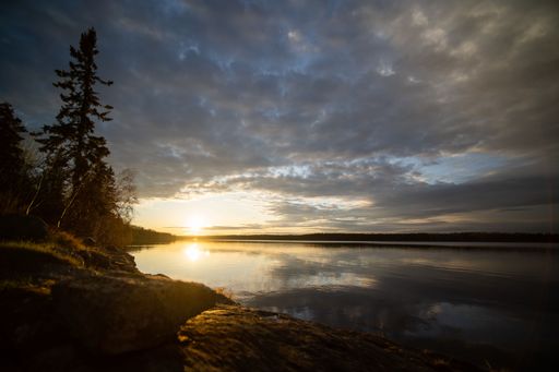 The sunset in the Secluded northern lake near La Ronge, Saskatchewan, Canada