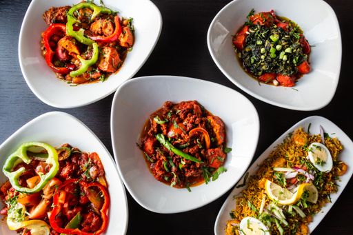 A top shot of different dishes in a white plate