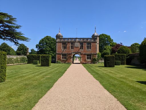 A beautiful shot of a trail leading to the Charlecote house gate