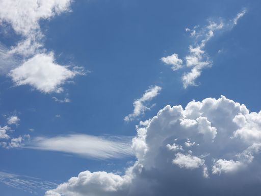Clouds in the blue sky - background and texture