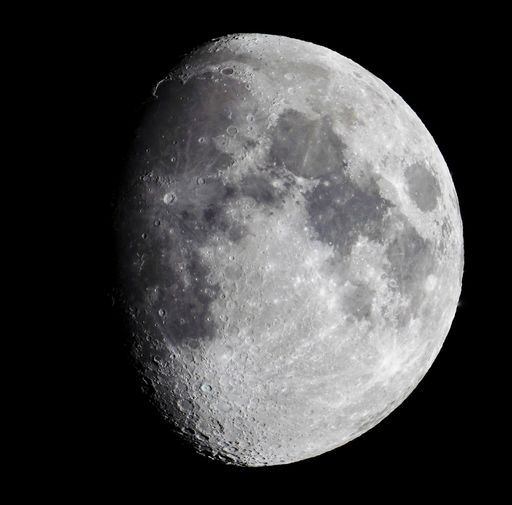 A closeup shot of the moon with a dark background