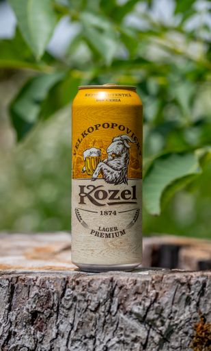 A vertical shot of Kozel beer with an authentic Czech recipe