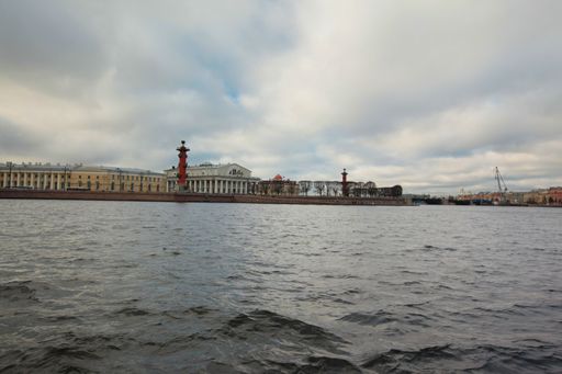 A beautiful view of the river, bridges and buildings in St. Petersburg under the cloudy sky
