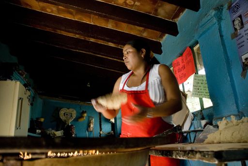 Woman cooking tortillas in Mexico