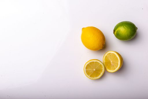 A top view of lemons and lime isolated on a white background