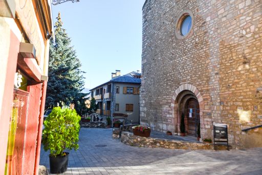 Alp, Spain : 2020 19 July : Main street behind the Church of Parroquia de Sant Pere in Summer. Alp, Spain  on July 2020 in summer