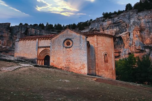 Hermitage of San Bartolome in the canyon of the river Lobos Soria, Spain with cliffs in the background