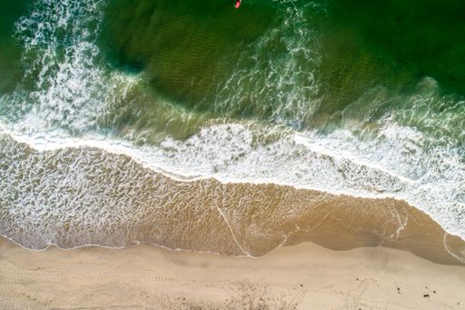 Aerial view of tropical sandy beach and ocean. Copy space