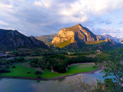 Landscape with mountain, lake and sky. Pyrenees in sunset. Wallpaper, background