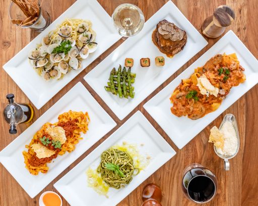 A top view of various tasty dishes on wooden table