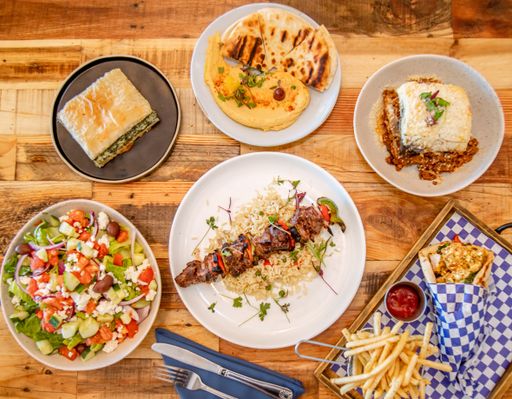A top view of various tasty dishes on wooden surface