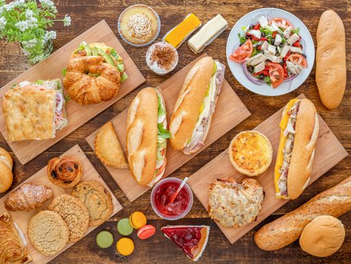 A top view of various tasty dishes on wooden surface