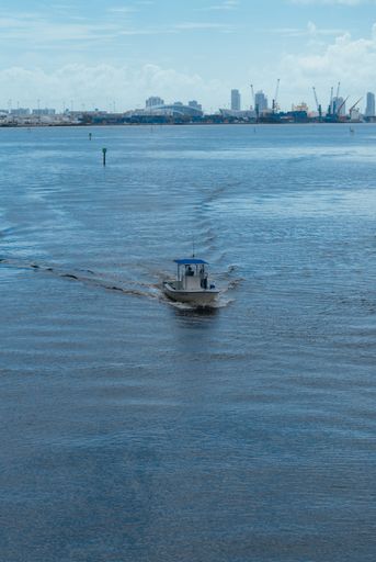 A vertical shot of the boat in the sea