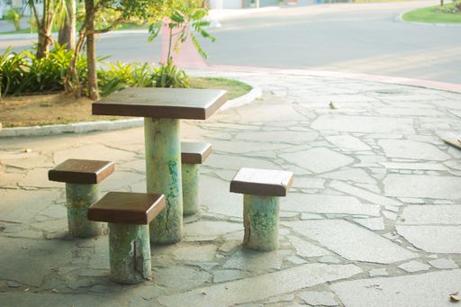 A corner with empty public seating and table