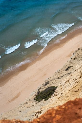 A vertical shot of the beach in Southern Portugal around the area of Lagos
