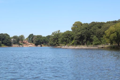 A beautiful lake and a wooden pier taken in Minnesota