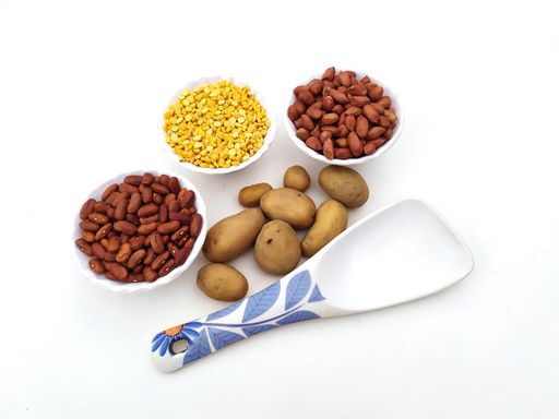Food grain put in a plastic bowl isolated on white background