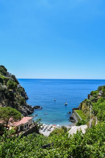 A vertical shot of the Tyrrhenian Sea and hills in Almafi Coast, Italy