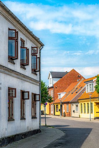 A view of Guldborgsund municipality building in Stubbekobing, Denmark under blue sky