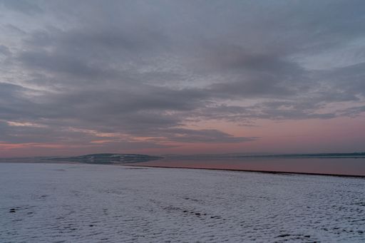 A beautiful view of Lake Mjosa at sunset in Oppland, Norway