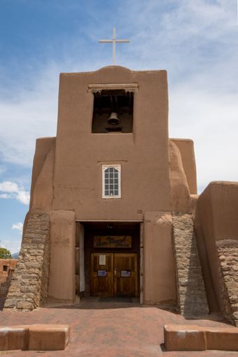 A vertical shot of the San Miguel Chapel in Santa Fe, New Mexico
