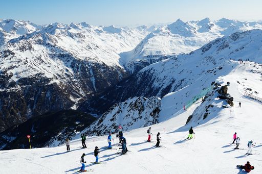 skiing and snowboarding in winter wonderland of the austrian alps
