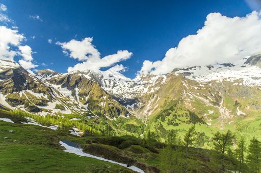 A beautiful shot of the snowy Austrian Alps from the  Grossglockner High Alpine road on a bright blue sky background