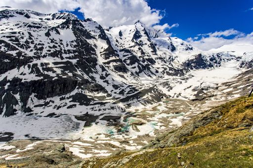 A beautiful shot of the snowy Austrian Alps from the  Grossglockner High Alpine road on a bright blue sky background