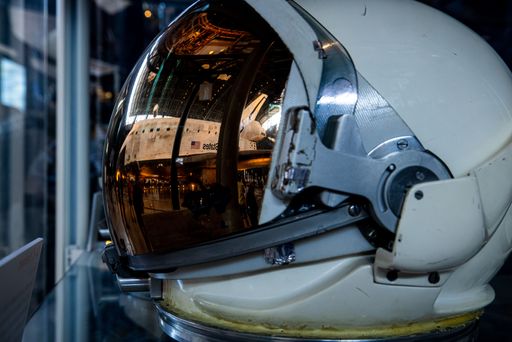 Space Shuttle Discovery reflected in the visor of an astronaut helmet at Smithsonian Air & Space Museum, Chantilly VA
