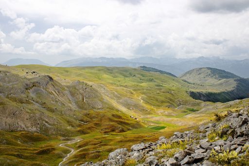 A beautiful shot of the Visocica mountain range under a blue cloudy sky during the daytime