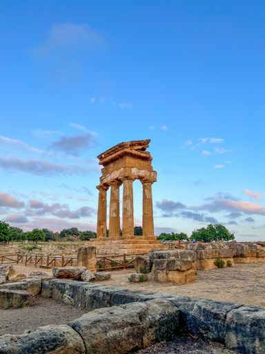 A vertical shot of the Temple of Dioscuri at Valley of the Temples, Agrigento, Sicily, Italy