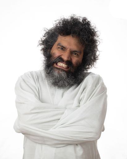 A crazy man expressing anger and discomfort in a straitjacket - the concept of mental illness and rage