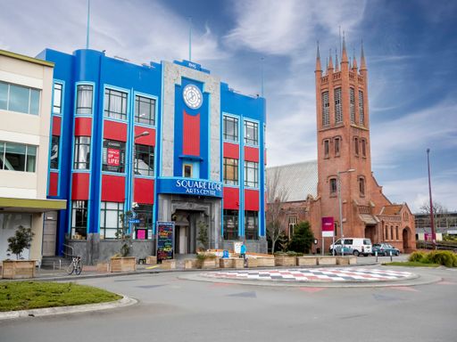 Palmerston North colourful Square Space art deco building. Centre for arts and crafts. on Church St. All Saints church along